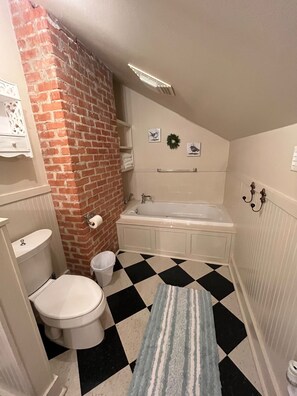 Bathtub, jetted bath, hair dryer, towels