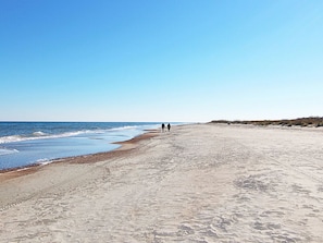 Walking along the beach, guests can enjoy the tranquil atmosphere and gentle waves.