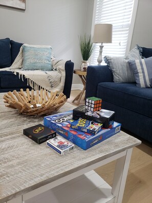 Relax in this inviting living space, where friends and family can gather to play board games and enjoy quality time together.