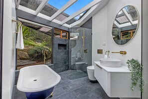 Combined shower/tub, hair dryer, towels, soap