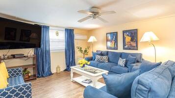 Condo, 1 Queen Bed, Kitchen, Garden View | Living area | 50-inch flat-screen TV with digital channels