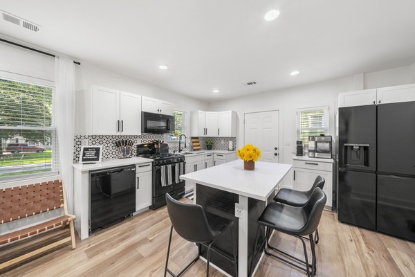 Another view of the kitchen and seating area