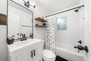 Combined shower/tub, hair dryer, towels, soap
