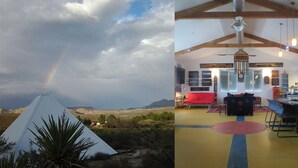 Eine pyramidenförmige Struktur, im Hintergrund ein Regenbogen und ein modernes Interieur mit Essbereich.