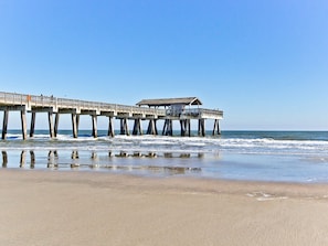 Walk along the pier's covered pathway, taking in the serene ocean views.