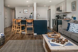 A compact living space with a kitchen, dining area, and seating area.