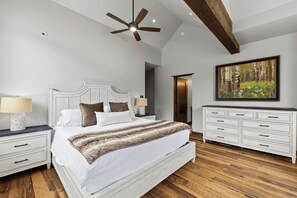A bedroom with a large bed, a ceiling fan, a dresser, and a painting on the wall. - 1.5 mi to Gondola/Town, 5-Star Perfection, Views (Breckenridge)