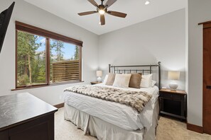 A bedroom with a bed, a nightstand, a lamp, a ceiling fan, and a window with blinds. - 1.5 mi to Gondola/Town, 5-Star Perfection, Views (Breckenridge)