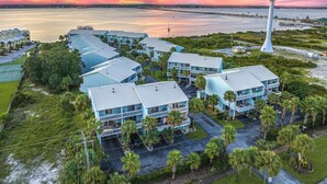 An aerial view of a coastal hotel with multiple buildings, a water tower, and a beach in the background. -  Beach. Walk everywhere. Peaceful. Location. (Navarre)