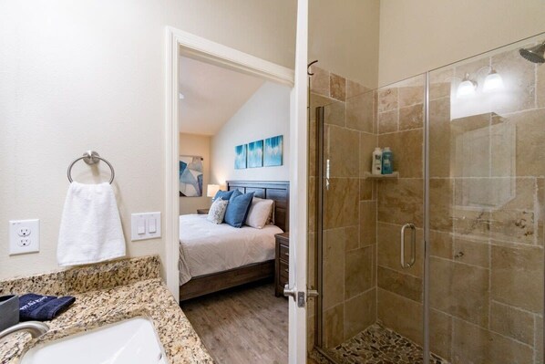 Bathtub, hair dryer, towels, shampoo - Two Waterfront Townhomes-Cape Crossing Resort (Merritt Island)