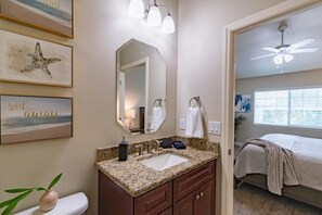 Bathtub, hair dryer, towels, shampoo