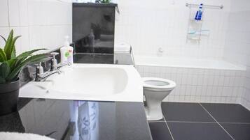 Shower, deep soaking tub, hair dryer, towels