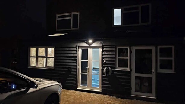 A two-story house with a garage, a front door with glass panels, and multiple windows. - Lopez Home Crawley (Crawley)