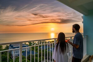 A balcony with a view of the sunset over the ocean. - Haya Hotel Phu Quoc, Trademark Collection by Wyndham (Phu Quoc)