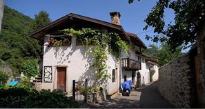 Traditional chalet-style building with a balcony and rustic charm.