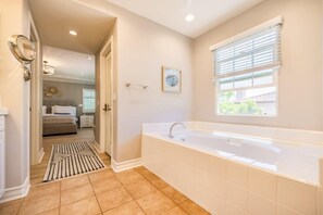 Bathtub, hair dryer, towels, soap