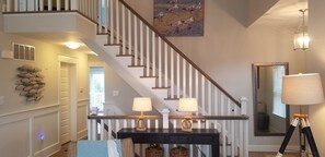 A staircase with white railings and a wooden handrail, leading to an upper floor. - 159 26th Street - Spacious home in the heart of Avalon, two blocks to beach. (Avalon)