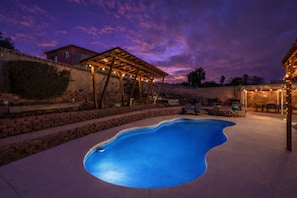 A swimming pool with a wooden pergola and outdoor seating area. - Arcade Lounge! Pool·Spa·Billiards·Dog Friendly (Las Vegas)