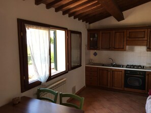 Enjoy meals in this cozy kitchen with a sink, stove, and dishwasher, and dine at the table with two chairs.