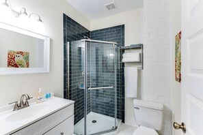 Shower, hair dryer, towels, shampoo