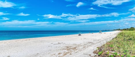 On the beach, sun loungers, beach towels