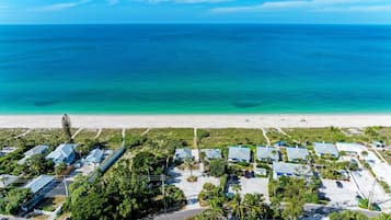 On the beach, sun loungers, beach towels