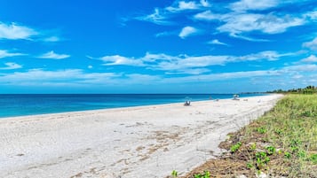 On the beach, sun-loungers, beach towels