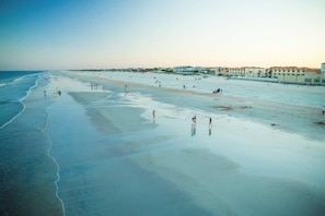 A beach with buildings in the background.