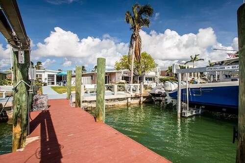 Stunning home on the canal with boat dock exclusive Key Colony Beach.