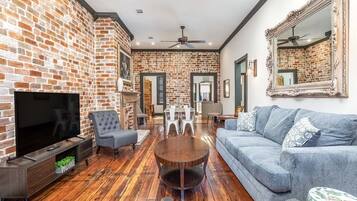 House, Multiple Beds, Fireplace, Garden View | Living area | 40-inch TV with digital channels, fireplace