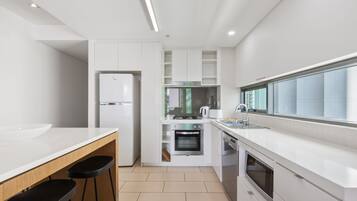 Apartment | Private kitchen | Full-size fridge, microwave, oven, stovetop