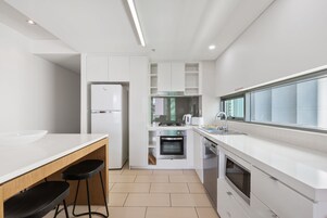 Apartment | Private kitchen | Full-size fridge, microwave, oven, stovetop