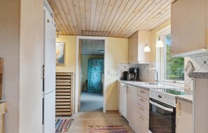 Fridge, stovetop, dishwasher, coffee/tea maker