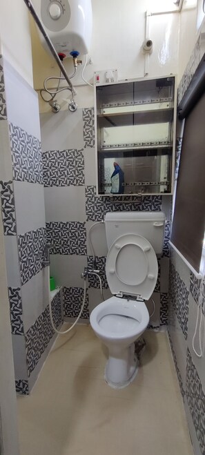Bathtub, hair dryer, towels, soap