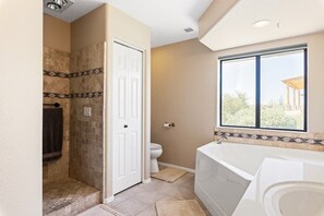 Bathtub, hair dryer, towels, shampoo
