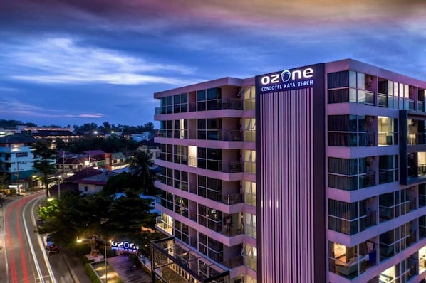 A multi-story building with balconies, labeled "Ozone Condotel Katana Beach."