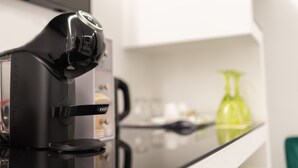 A coffee machine with a control panel and a label that reads "KRUPS." - Room in B&B - B&B Kreart Suite & Rooms (Crotone)