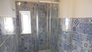 A bathroom with a shower, toilet, and sink. - The Home of Athena Paestum (Capaccio-Paestum)