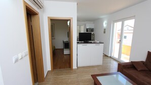 A modern apartment with a living area, kitchenette, and a dining space. - Hanna One-bedroom Apartment (Rovinj)