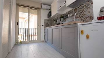 House, 1 Bedroom, Balcony | Private kitchen | Microwave, coffee/tea maker, dining tables