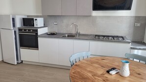 Apartment, 1 Bedroom, Smoking | Private kitchen - Illy .1. Apartment. (Alghero)
