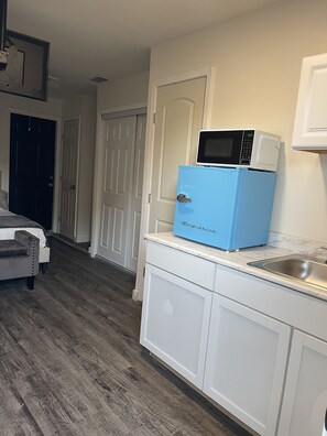 Fridge, microwave, cookware/dishes/utensils