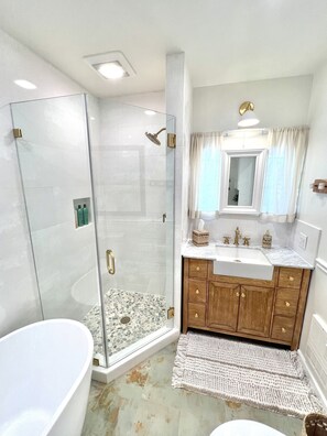 Bathtub, hair dryer, towels, soap