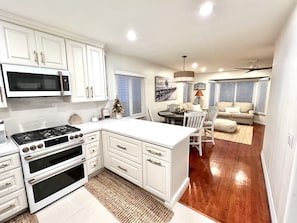 Enjoy cooking and dining in this well-equipped kitchen with a central island and dining area.