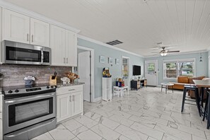 Fridge, microwave, oven, stovetop - Coastal Cabana ~ Cozy getaway in the heart of town w/a privately fenced backyard (Panama City Beach)