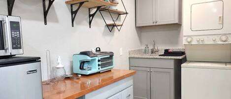 Microwave, coffee/tea maker, toaster, dining tables