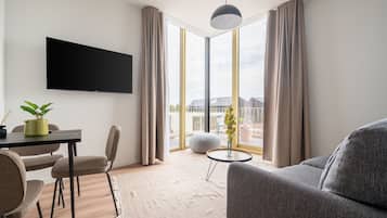 Suite with Sofa Bed & Balcony | Living area | Smart TV