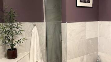 Bathtub, hair dryer, towels, soap