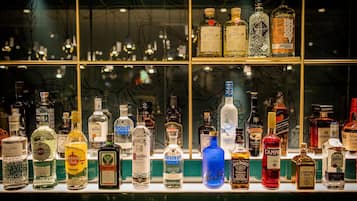 A bar with various liquor bottles displayed on shelves.