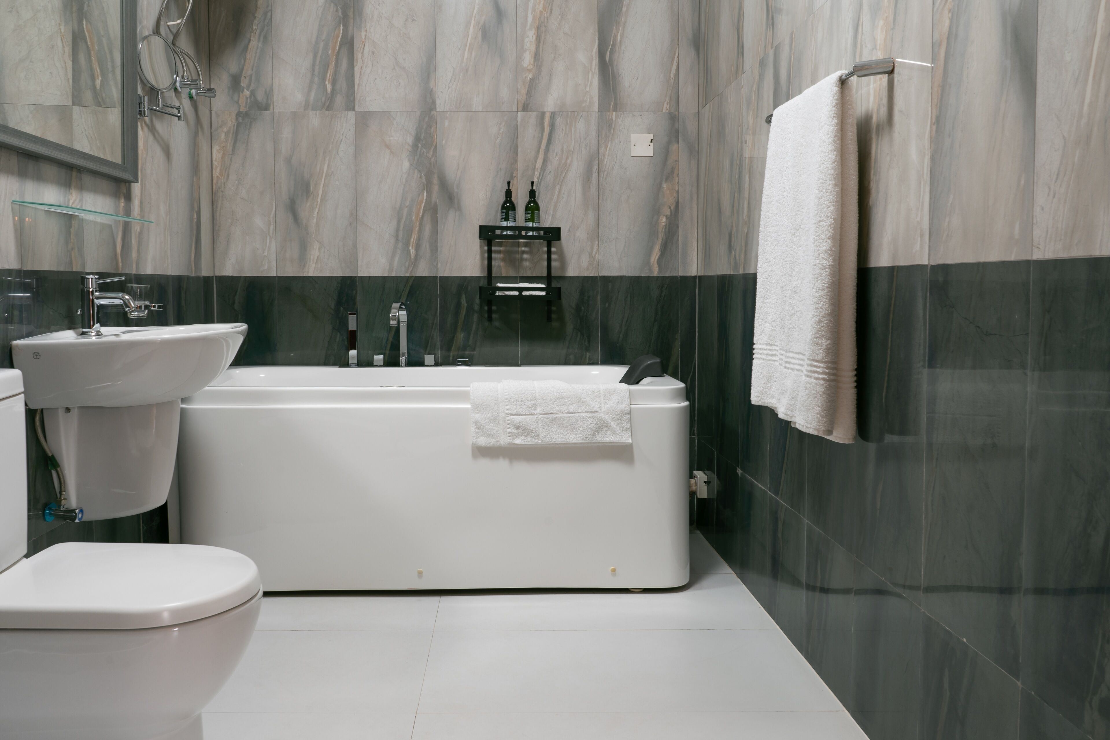 luxury townhome | bathroom | separate bathtub and shower, rainfall showerhead, free toiletries